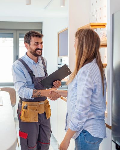 A contractor shaking hands with a client
