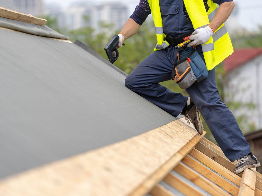 A roofer working on a roof replacement