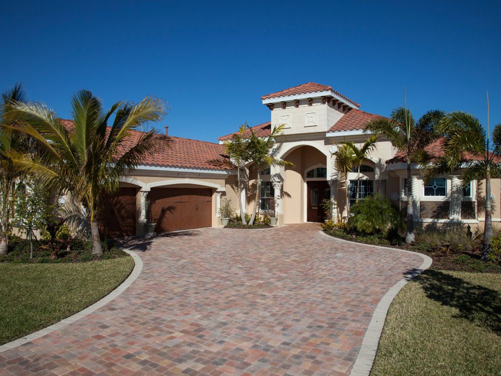 A roofer installing tiles on a new roof in Palm Beach Florida