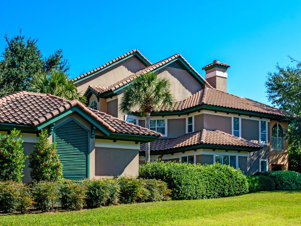 A roofer installing tiles on a new roof in Palm Beach Florida