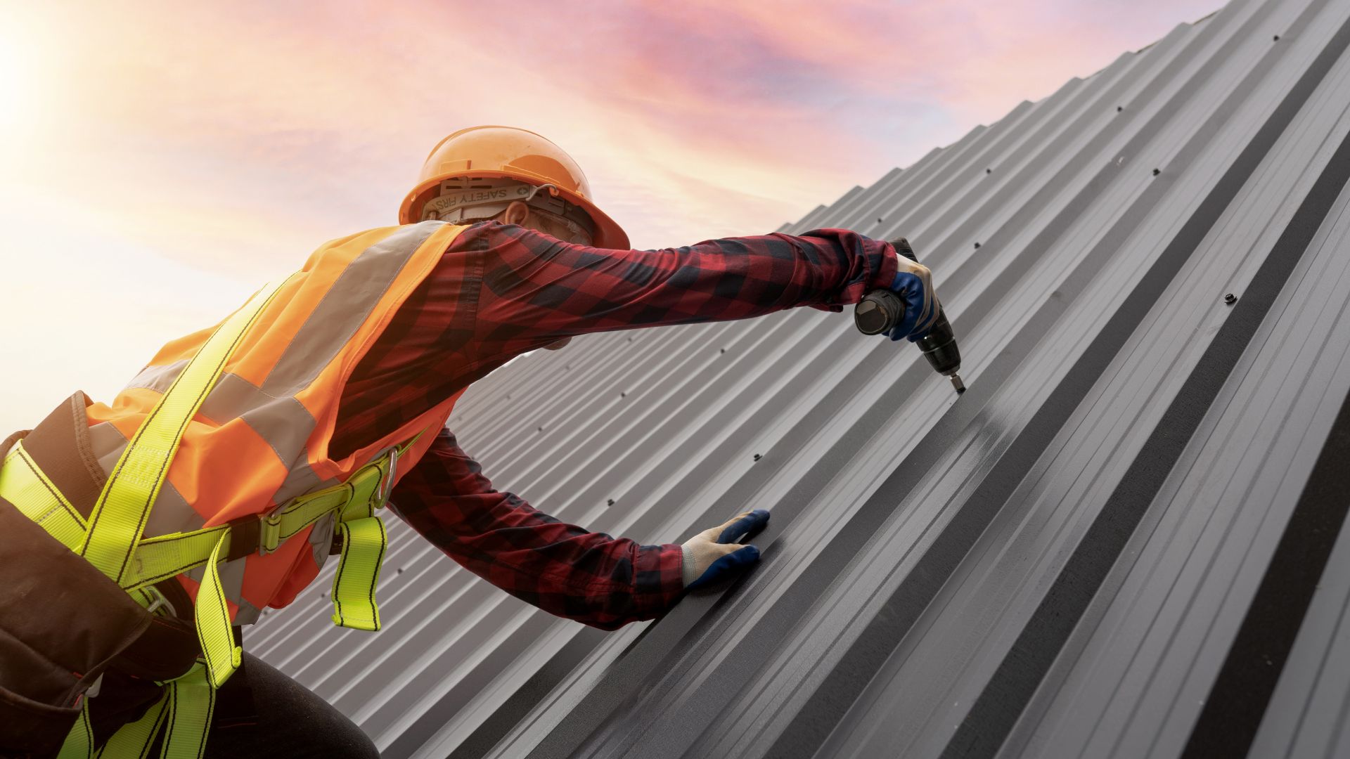 a man drilling on a roof